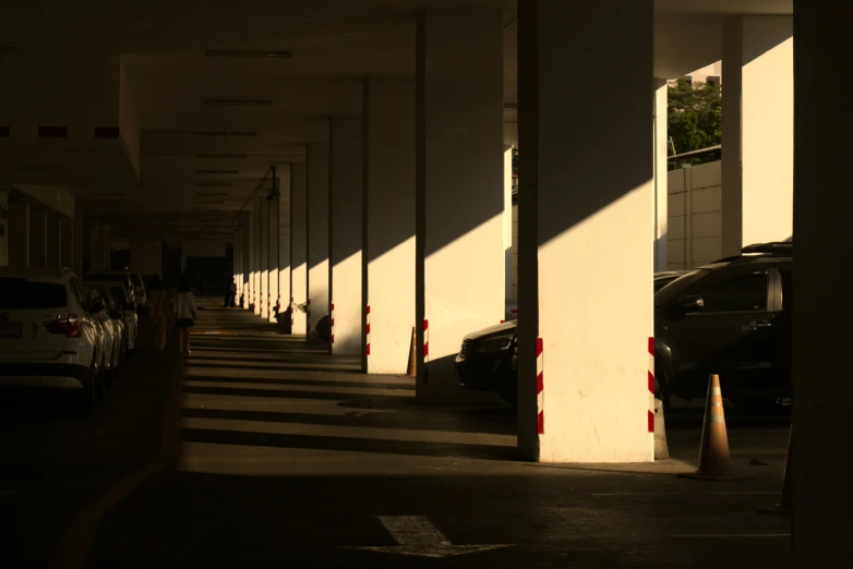 the cars are parked near the curb of an empty building