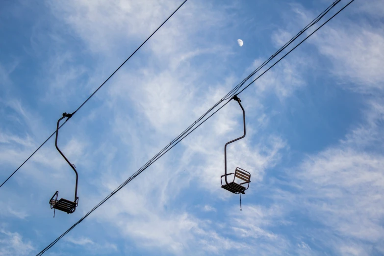 a couple of lift lifts over a city