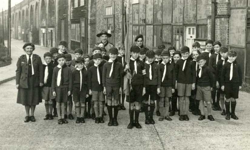 boys and women with ties and hats and in uniforms