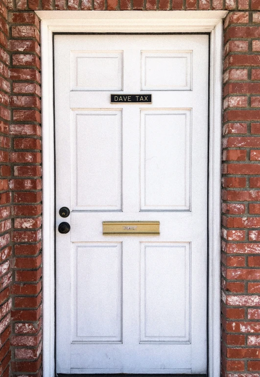 a door with the name and number carved on it