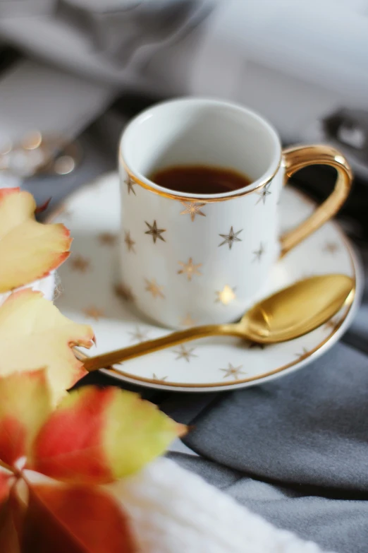 coffee sits next to leaves and a knife