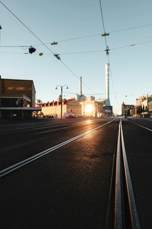 the sun is shining down on the power lines