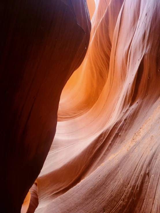 the sunlight streams into a slot in antelope canyon