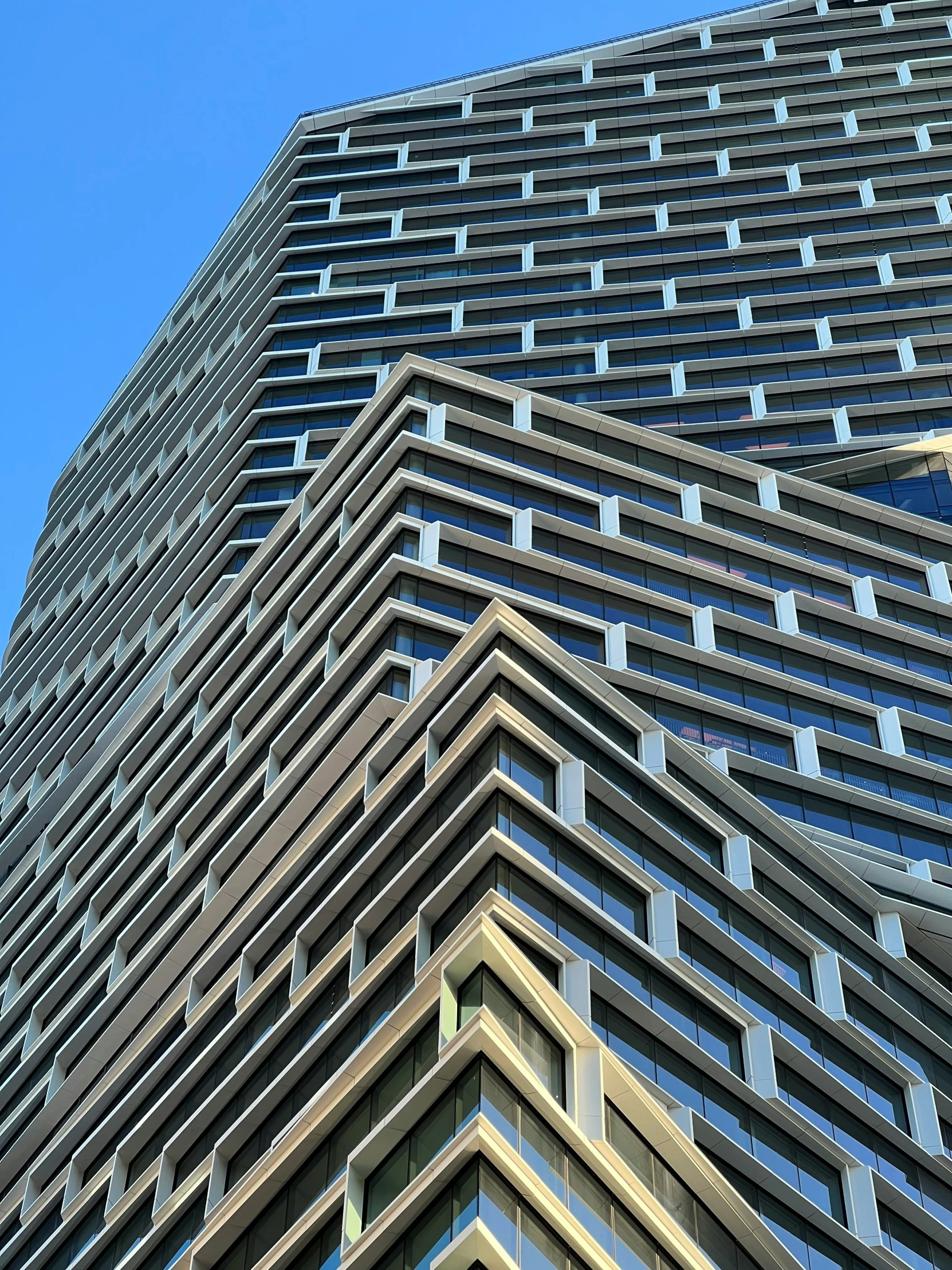 a very tall building with many windows and balconies