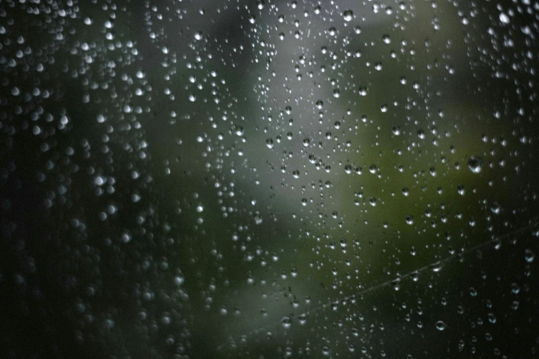 a close up of rain drops on the window