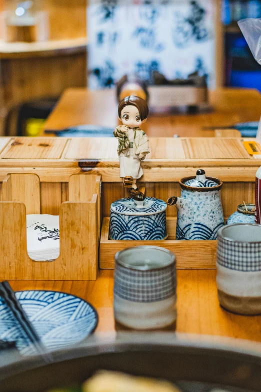 an asian toy sitting in a wooden container