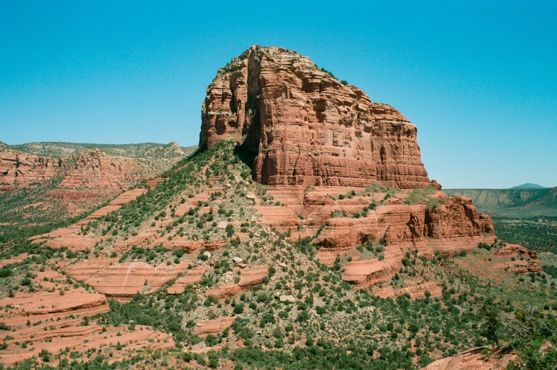 a rock hill near a large valley in the desert