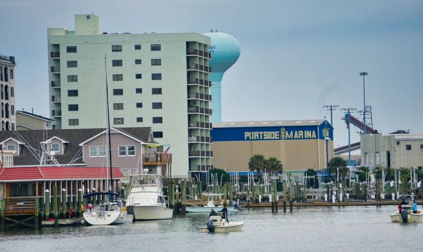 a body of water with several boats and buildings