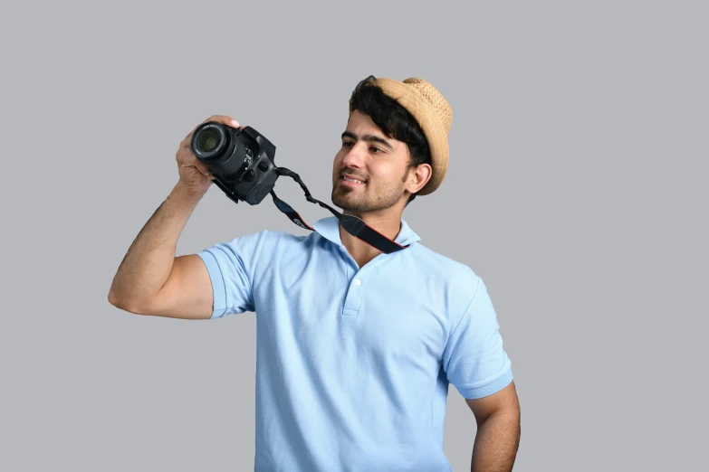 a man is holding his camera and taking pictures
