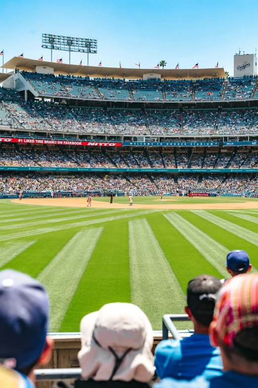 baseball game in progress with many fans watching