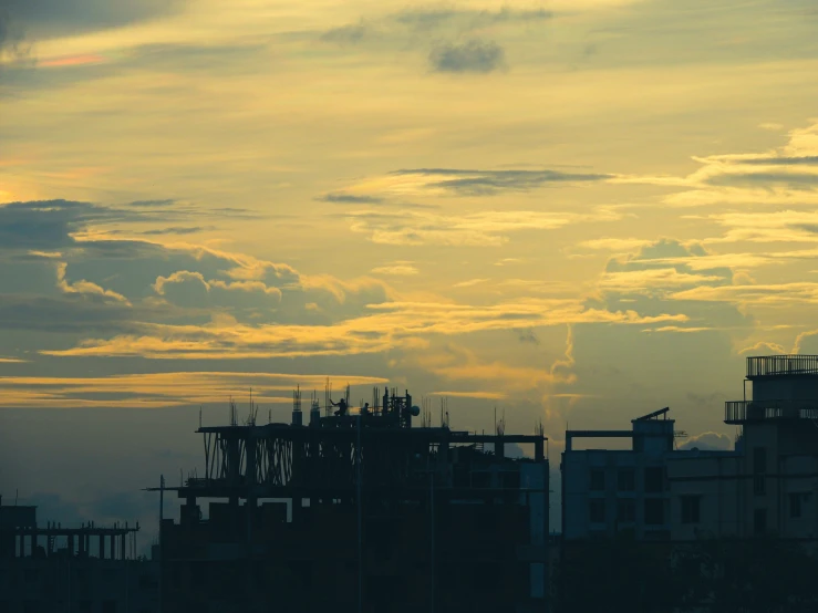 the skyline is silhouetted against the backdrop of dark, cloudy skies