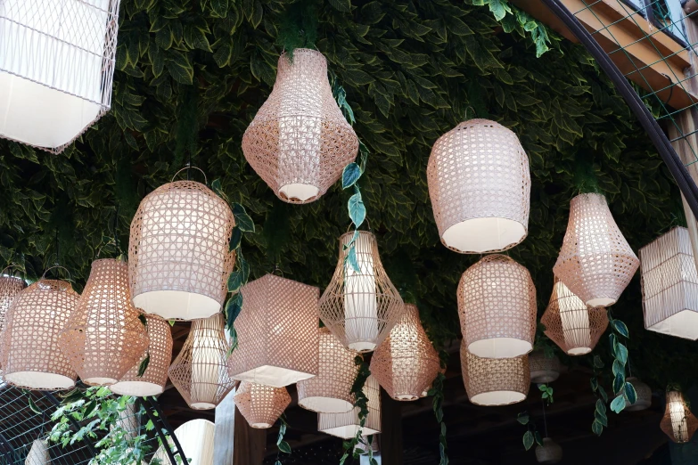 a bunch of brown decorative hanging lamps with lights