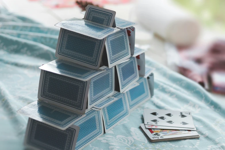 a stack of playing cards on top of a table