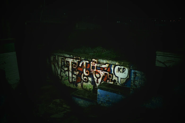 there are many letters on the wall with graffiti