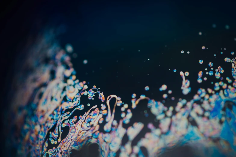several bubbles are in front of a black background
