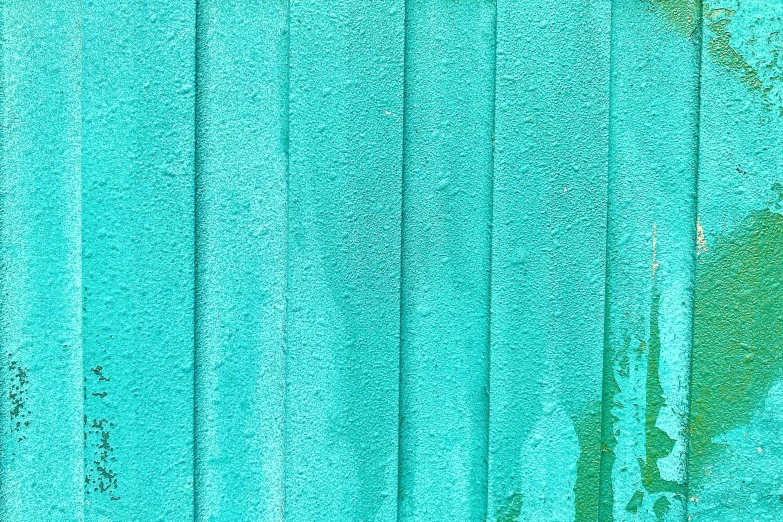 a blue curtain sitting on top of a wooden bench