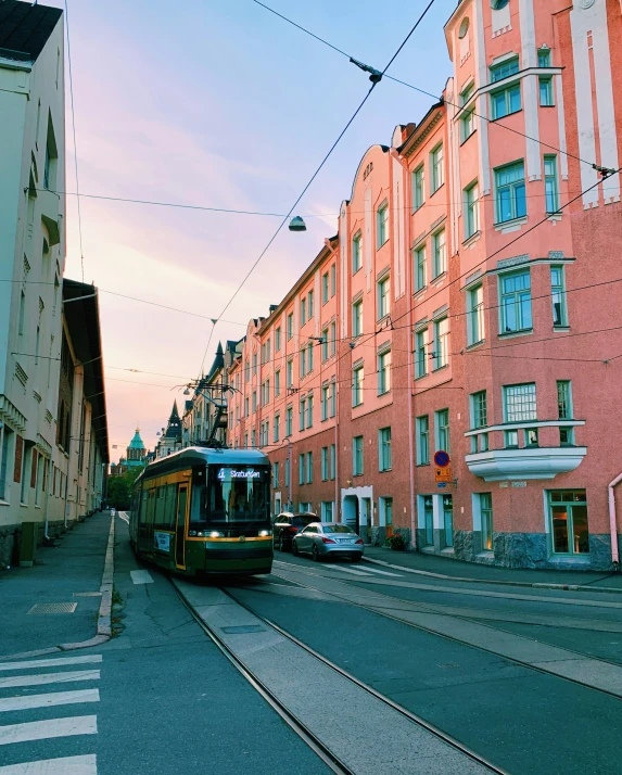 an electric train moves along the tracks in the city