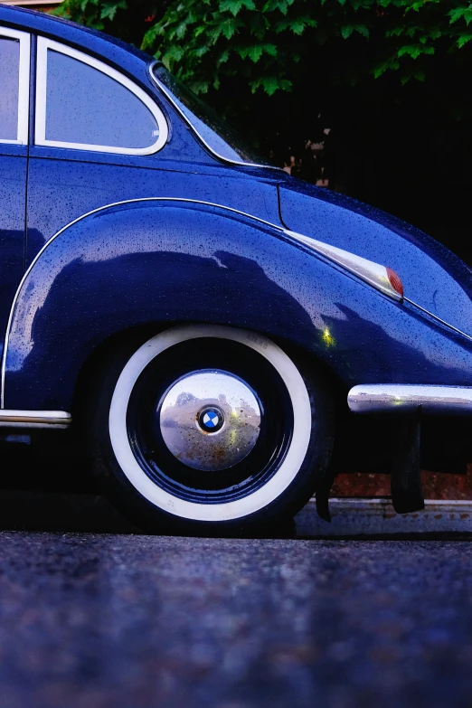 a close - up po of an antique vw bug