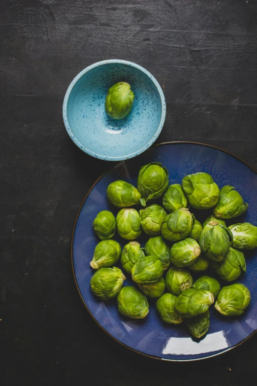 a bowl filled with green brussel sprouts