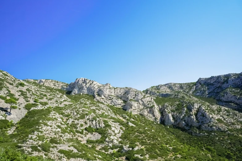 the mountain is very steep, and it looks like it has many rocks