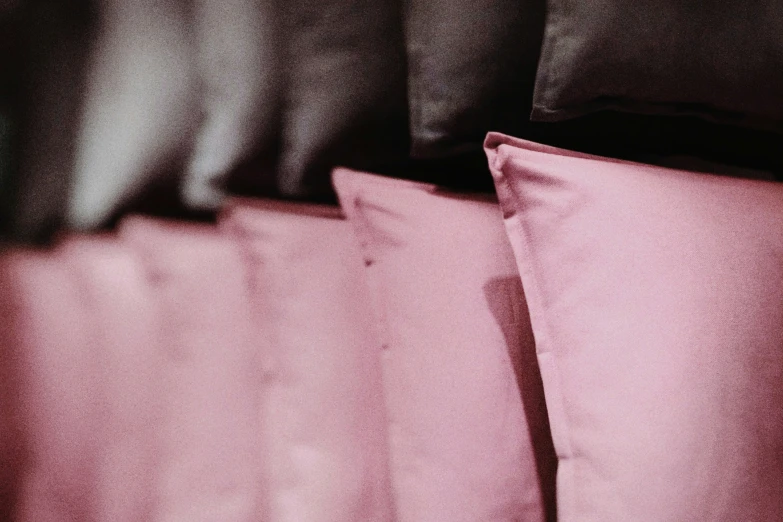 a closeup of pillows and sheets in a bedroom