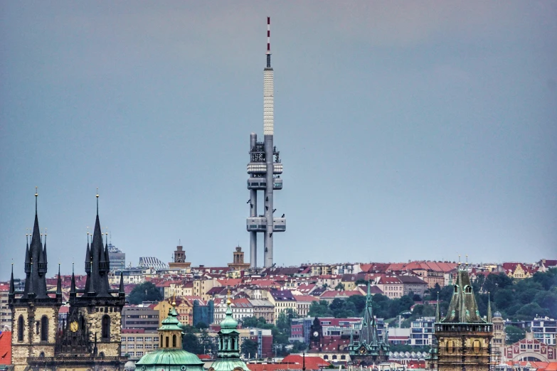 a tower in the distance with a spire atop it