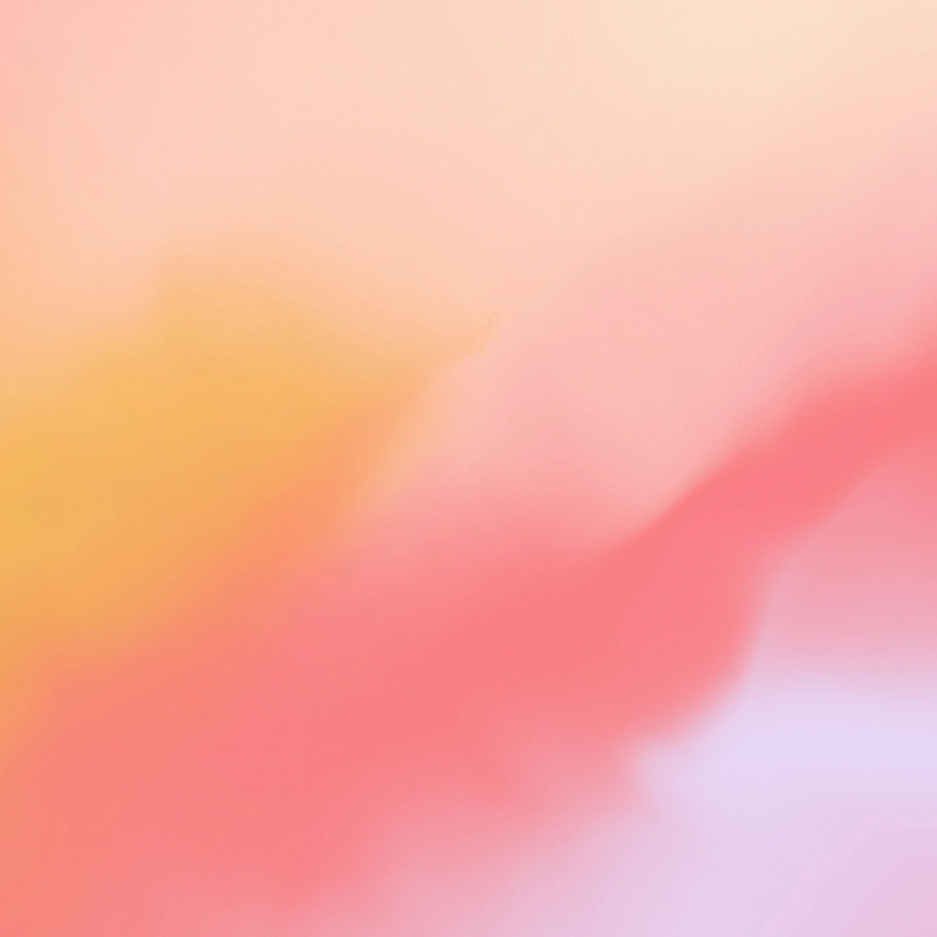 blurry picture of orange and red colors on a light pink