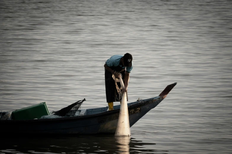 an image of man on boat in the water