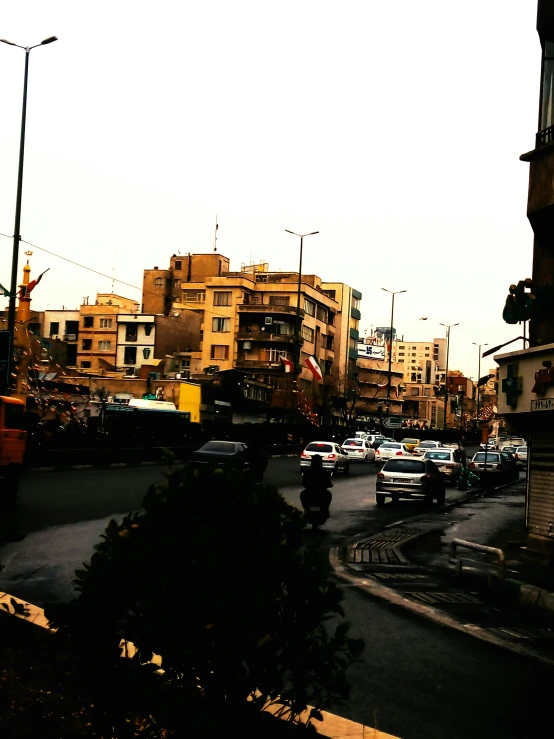 a city street with cars driving down the road