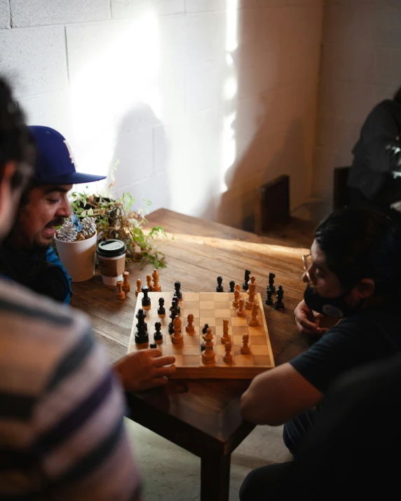 two people playing chess on the ground