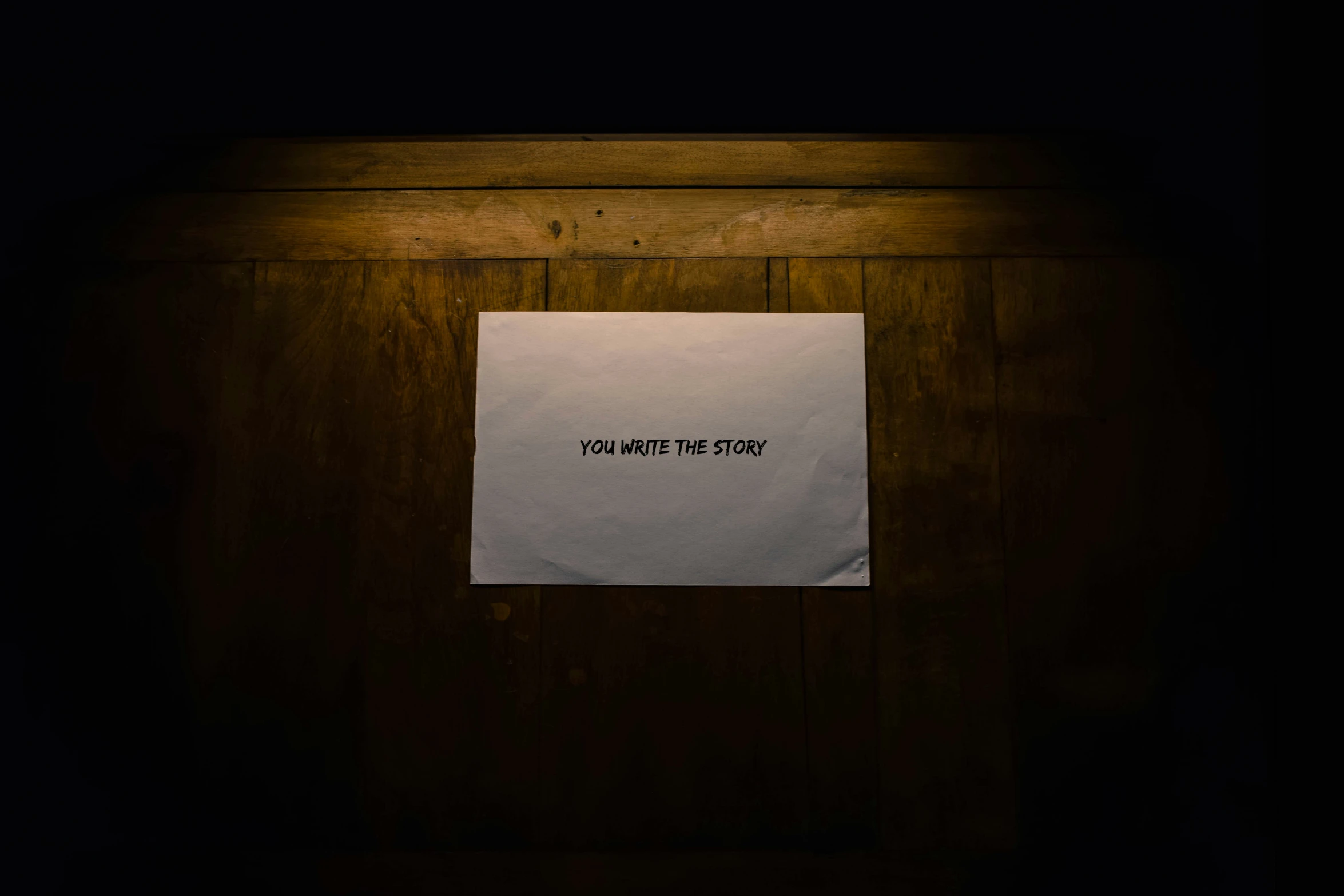 a piece of paper hangs on the wall