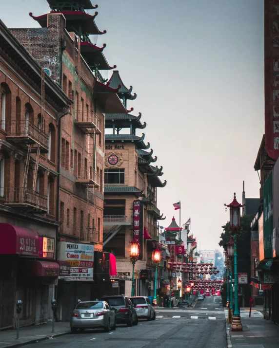 many different buildings are on a busy street