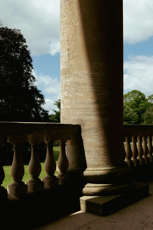 a tall column and a building in the background