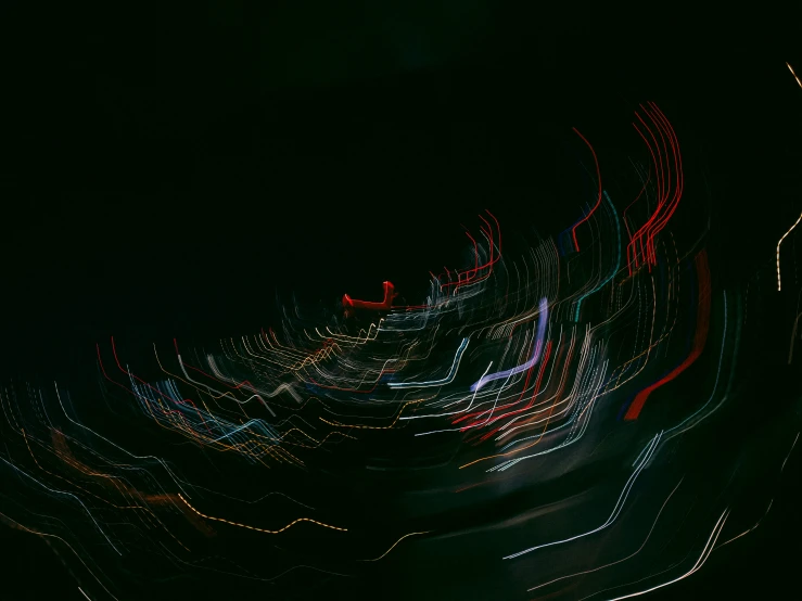 multiple color blurred motion lights in the dark