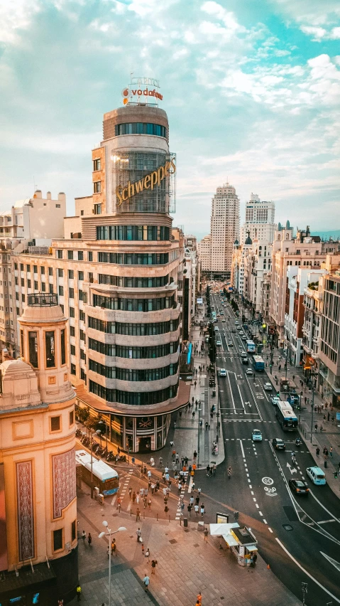 a city street scene with buildings and people in it