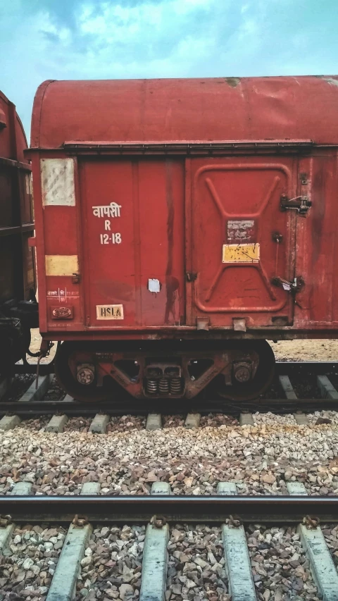 a train car is sitting on the tracks