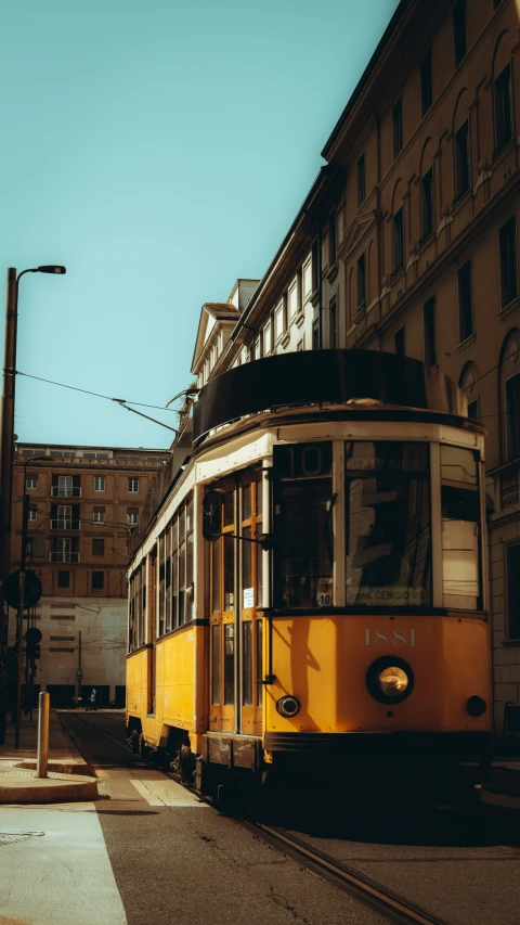 a street car driving through a parking lot