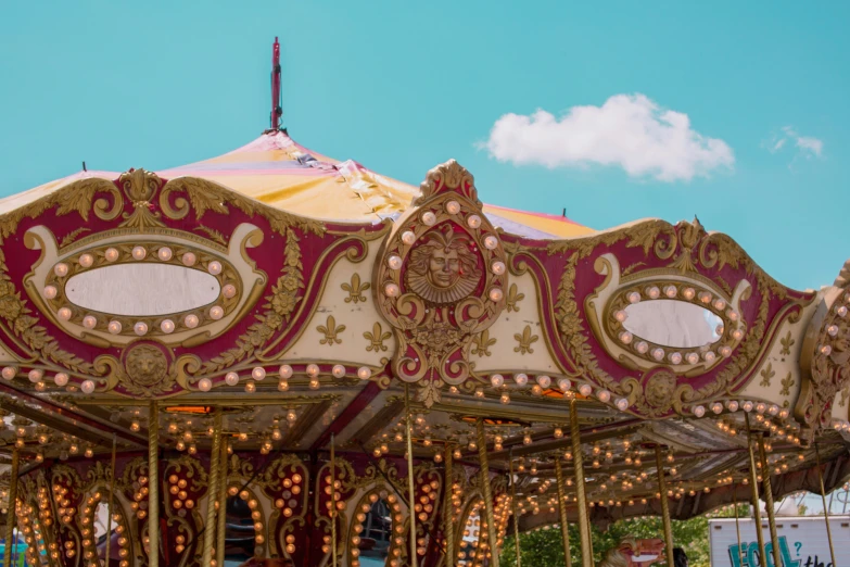 the ornately decorated carousels has many decorations