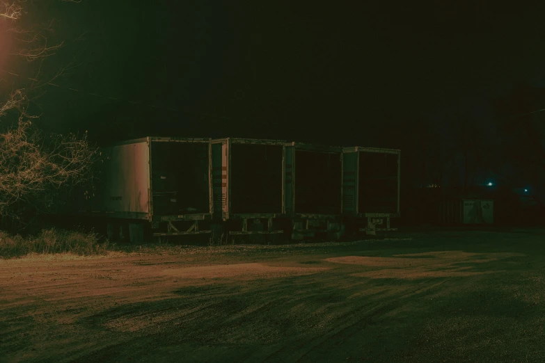 a night s shows two trailers on the side of the road