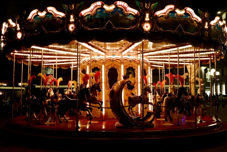 there are two horse on the merry go round