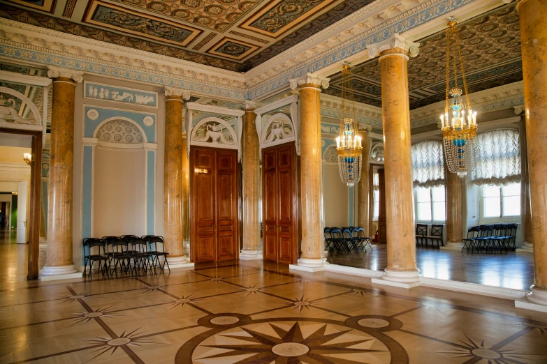 ornately decorated lobby and parlor with large doorways