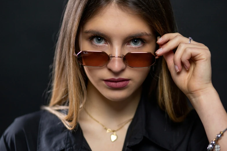 a woman wearing glasses with brown tinted lenses