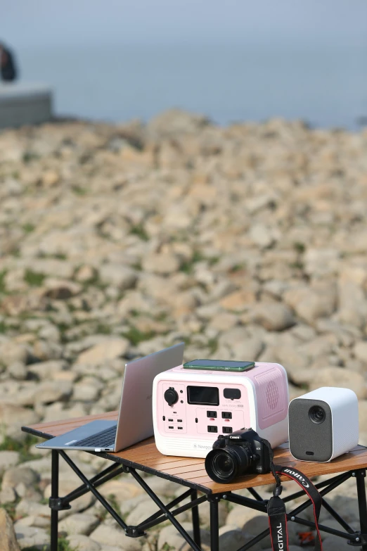 a boombox sitting on top of a table next to some electronics