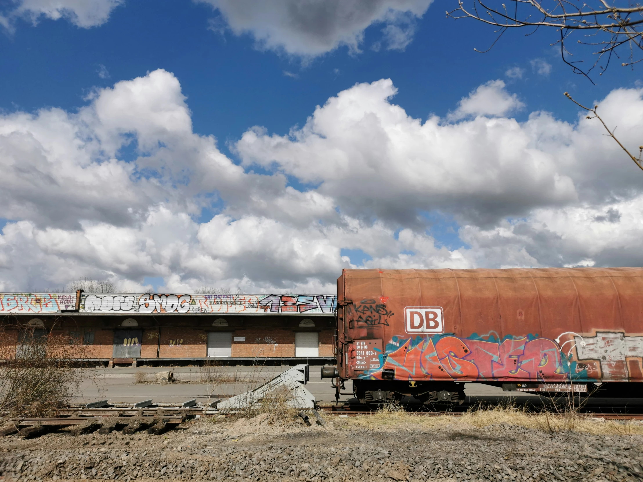 an old train car is painted with graffiti