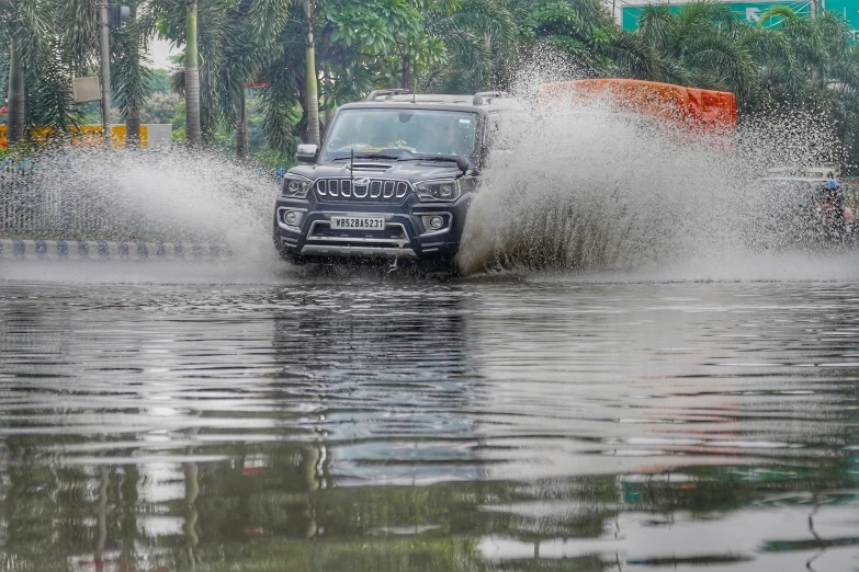 there is a jeep driving in the water