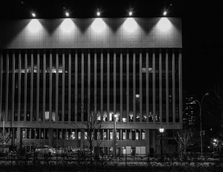 an office building in a city lit up at night