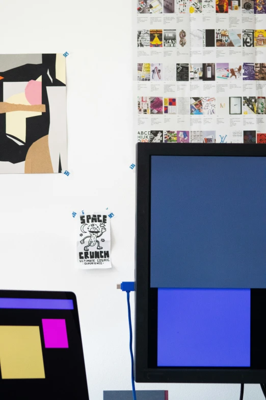 a desk with a computer monitor and a keyboard on top