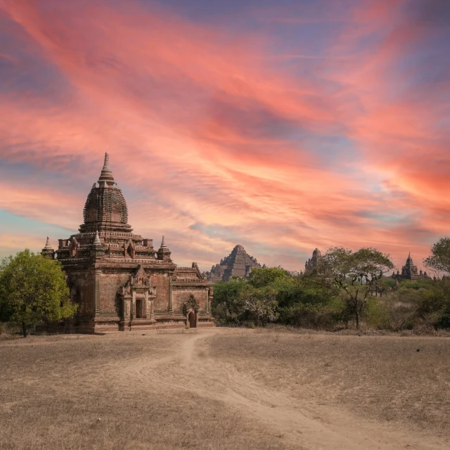 a po of a church and a dirt road in the middle of nowhere