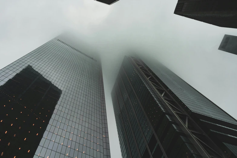 skyscrs on a misty day, taken from the ground up