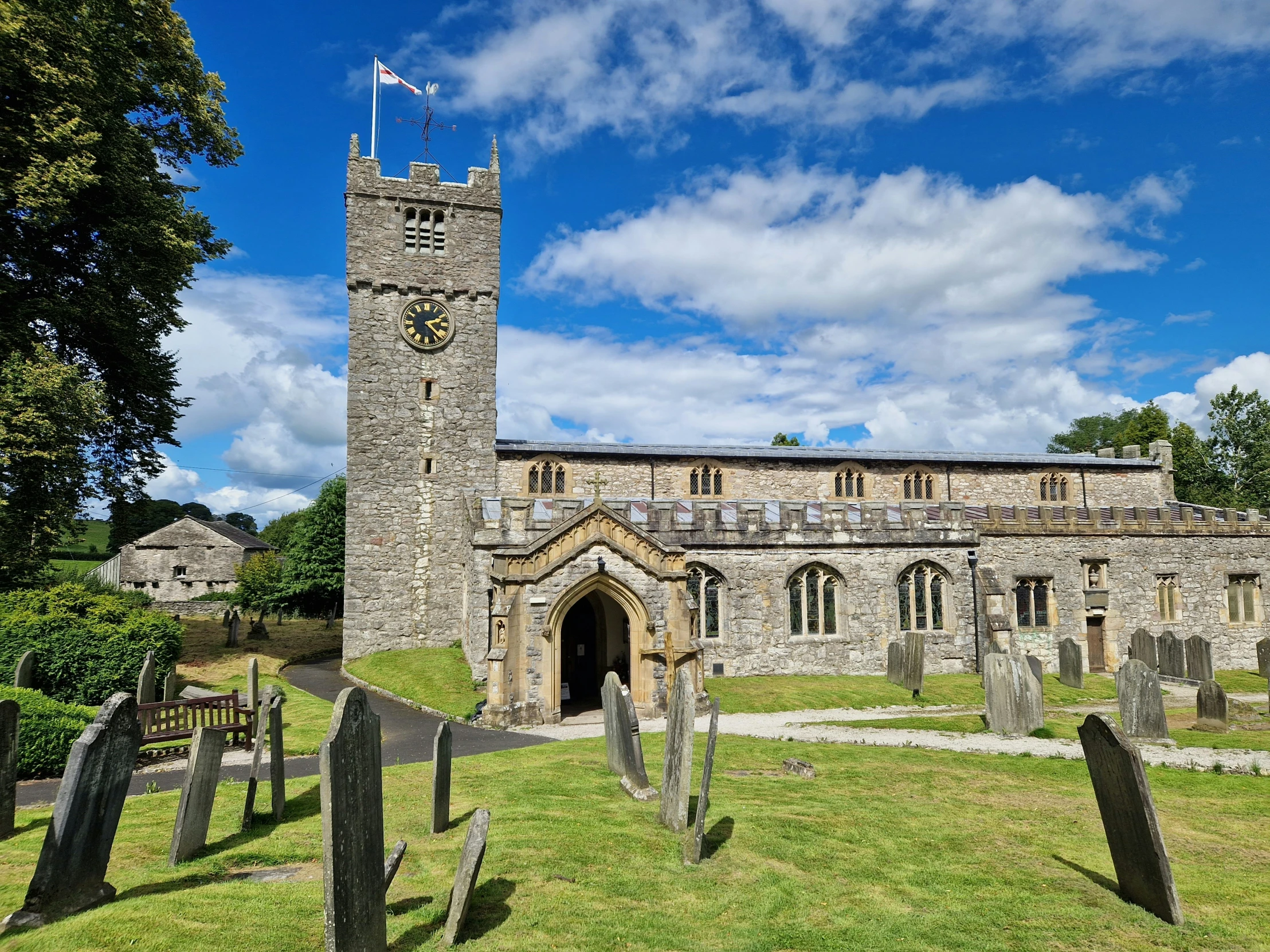 the old castle and graveyard are surrounded by graves